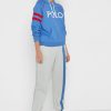 Beigefarbene Jogginghose mit seitlichen Streifen von Ralph Lauren für Damen Beigefarbene Jogginghose mit seitlichen Streifen von Ralph Lauren für Damen