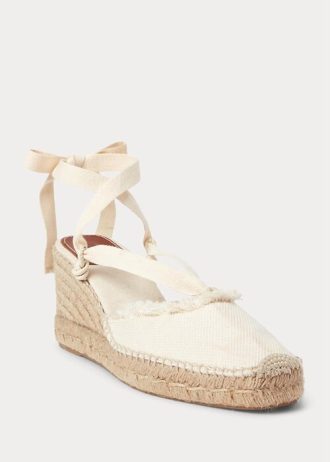 Cremefarbene flache Keilschuhe aus Canvas mit Fransenbesatz für Damen von Ralph Lauren