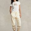 Cremefarbene Fleece-Jogginghose mit Schneeflockenmotiv von Ralph Lauren für Damen Cremefarbene Fleece-Jogginghose mit Schneeflockenmotiv von Ralph Lauren für Damen