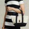 Ecru/Schwarze Ralph Lauren Canvas-Tragetaschen mit kleinem Polo Bear für Damen Ecru/Schwarze Ralph Lauren Canvas-Tragetaschen mit kleinem Polo Bear für Damen